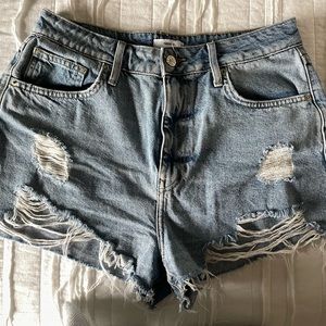 High-rise ripped denim shorts